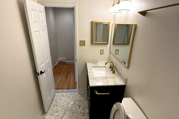 Spotless upper bathroom with polished fixtures